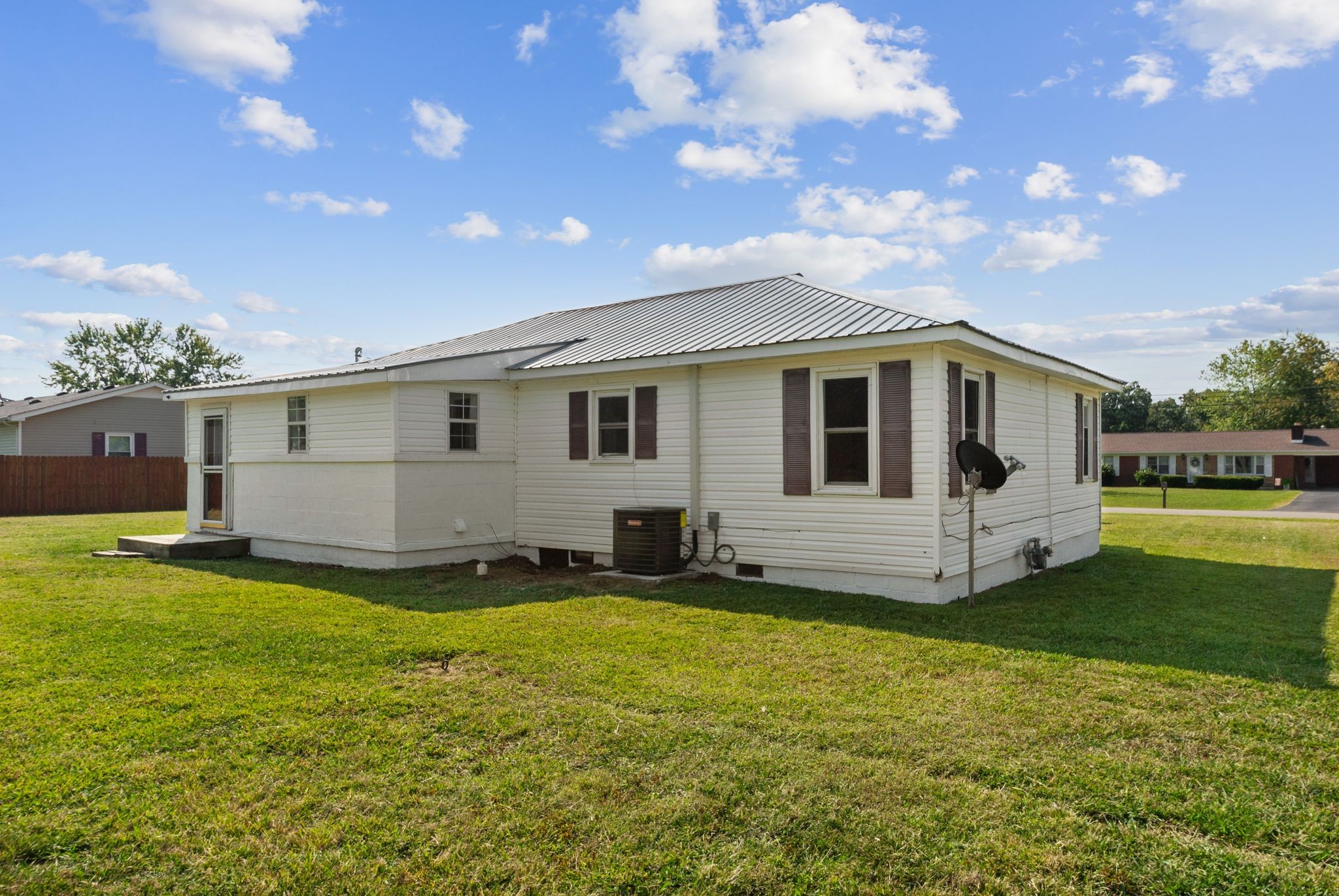 731 Smith Avenue Hohenwald, TN 38462 - Photo 28 of 28 a view of a house with a yard