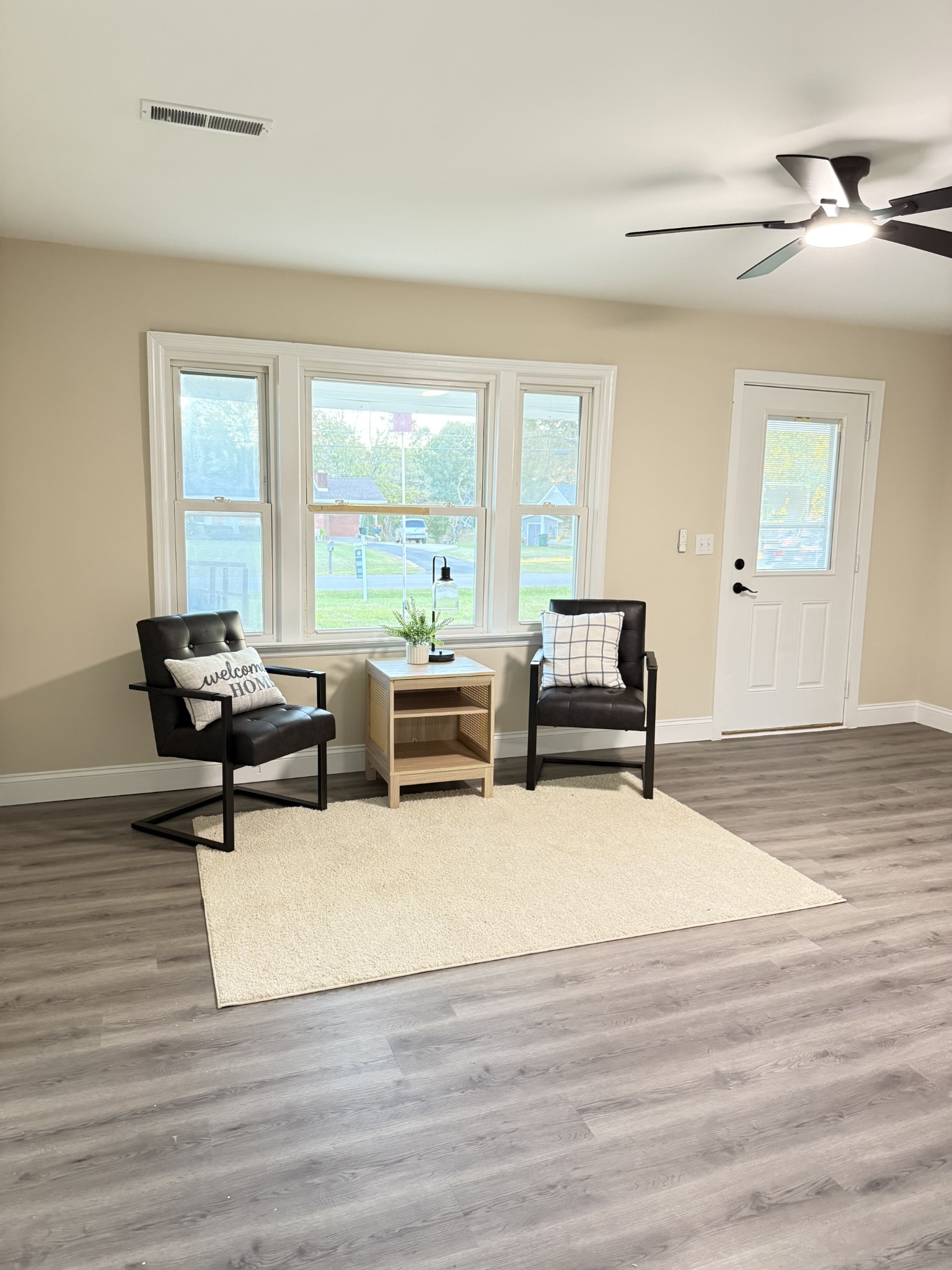 731 Smith Avenue Hohenwald, TN 38462 - Photo 7 of 28 a living room with furniture and floor to ceiling window