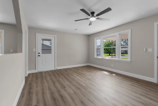 a view of a livingroom with wooden floor