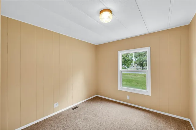 an empty room with a empty space and a window