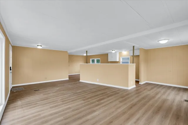 a view of a kitchen with wooden floor