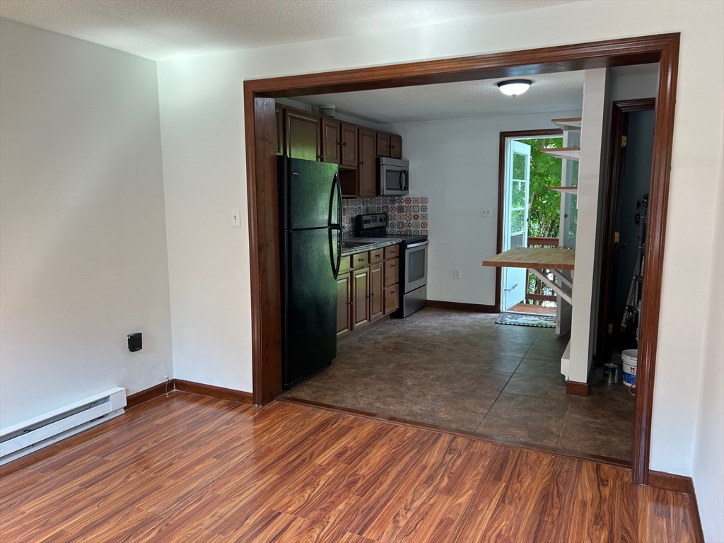 67 Everard Street Worcester, MA 01605 - Photo 3 of 13 a view of a living room and hardwood floor