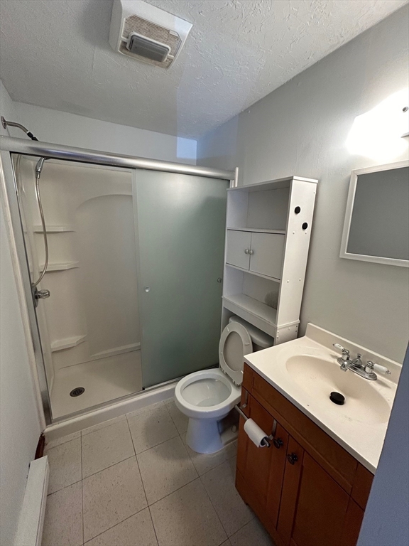 67 Everard Street Worcester, MA 01605 - Photo 10 of 13 a bathroom with a granite countertop sink toilet and shower