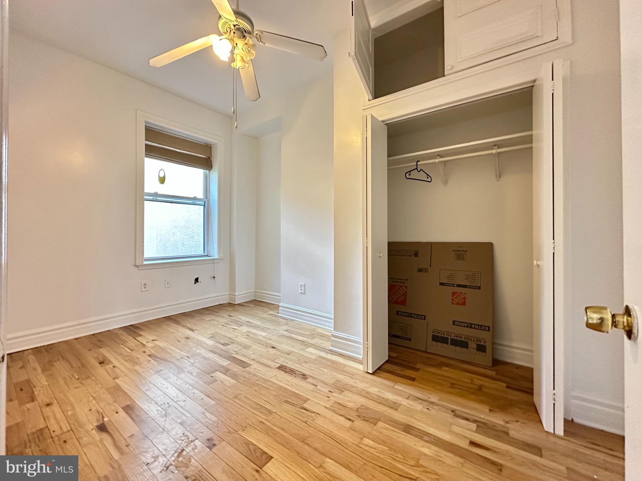 1214 North 5th Street, Unit 2 Philadelphia, PA 19122 - Photo 8 of 17 a view of room with window and hardwood floor