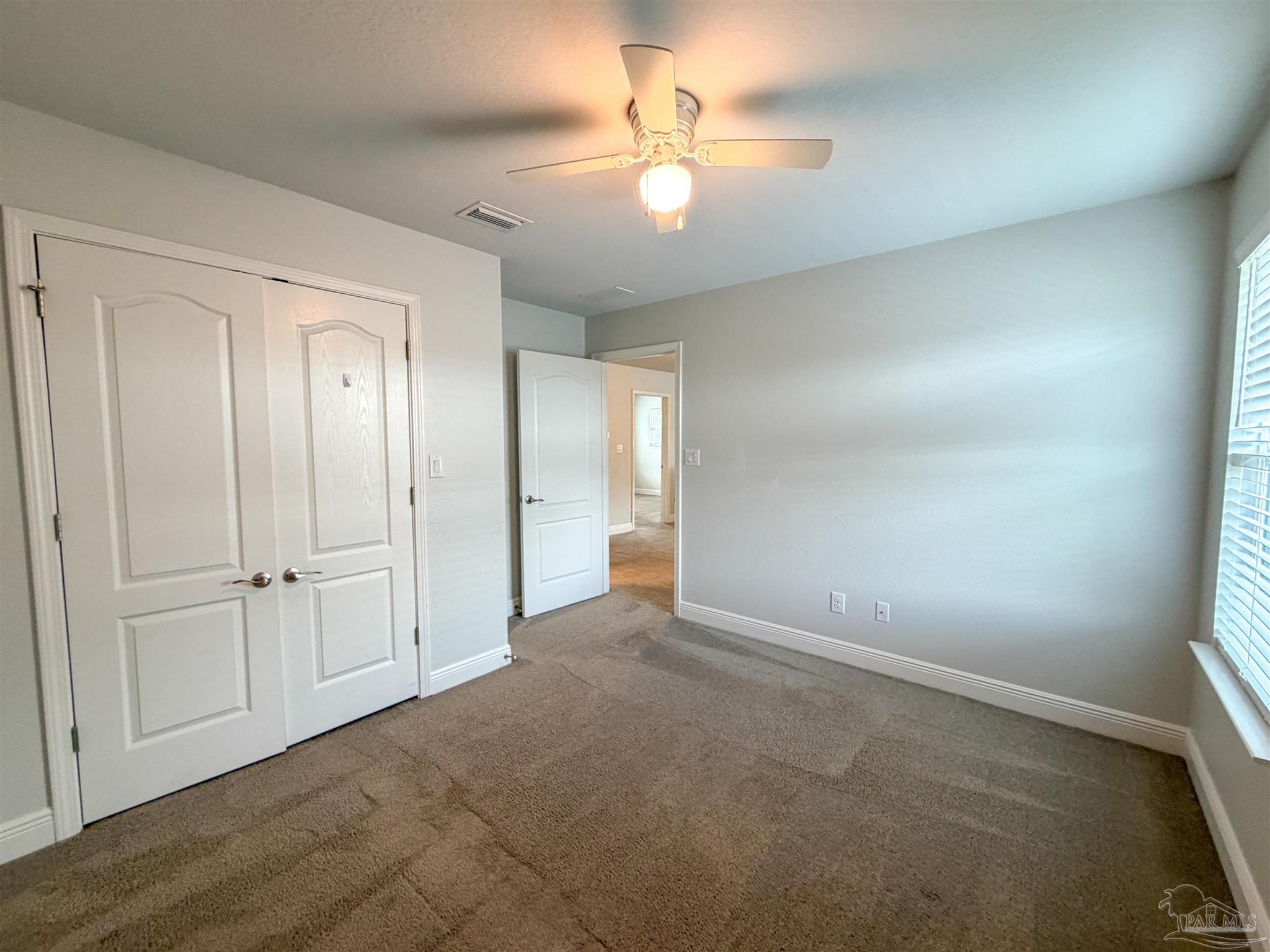 3613 Conley Drive Cantonment, FL 32533 - Photo 27 of 32 an empty room with fan and entrance