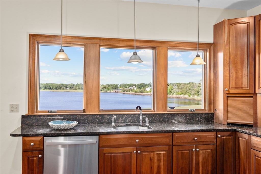17 River Road Marion, MA 02738 - Photo 14 of 36 a kitchen with granite countertop a sink and a window