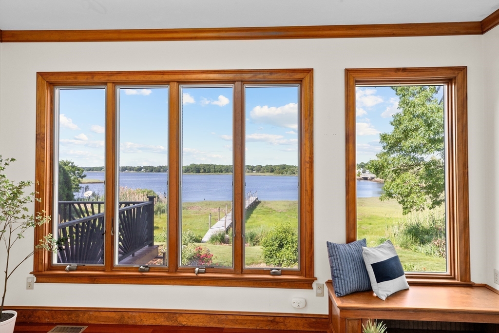 17 River Road Marion, MA 02738 - Photo 8 of 36 a view of a living room and floor to ceiling window
