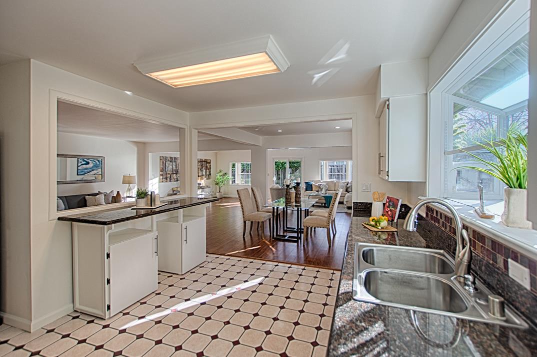 1663 Spring Street Mountain View, CA 94043 - Photo 13 of 31 a kitchen with a sink and chairs