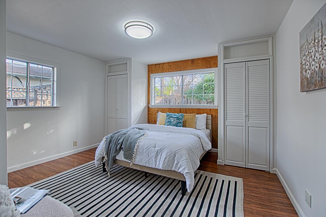1663 Spring Street Mountain View, CA 94043 - Photo 20 of 31 a bedroom with a bed and wooden floor