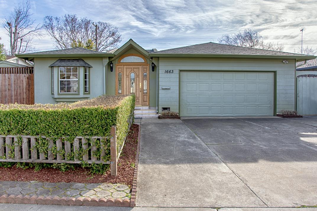 1663 Spring Street Mountain View, CA 94043 - Photo 2 of 31 a front view of a house with garage