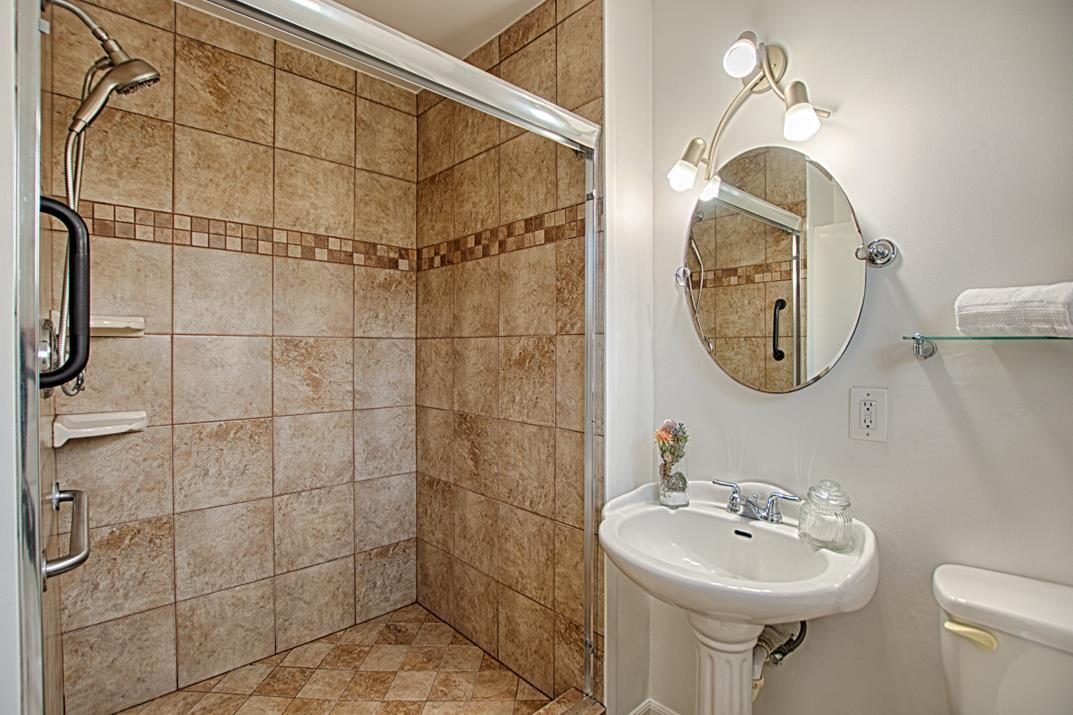 1663 Spring Street Mountain View, CA 94043 - Photo 21 of 31 a bathroom with a sink mirror toilet and shower
