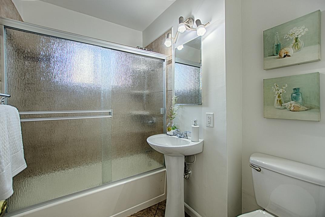 1663 Spring Street Mountain View, CA 94043 - Photo 22 of 31 a bathroom with a sink a toilet and shower