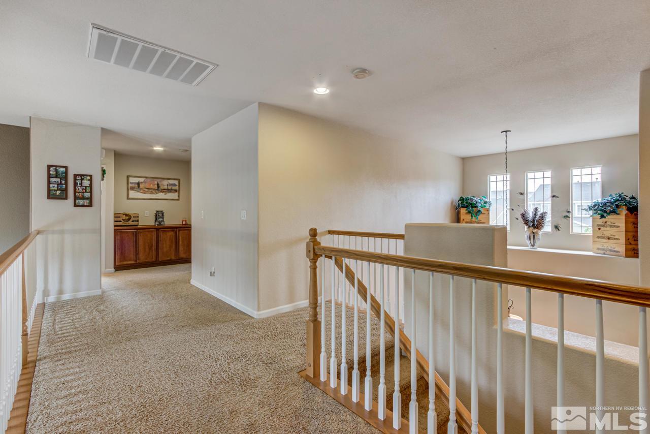 8921 Sorcha Street Reno, NV 89506 - Photo 18 of 35 a view of a hallway with living room