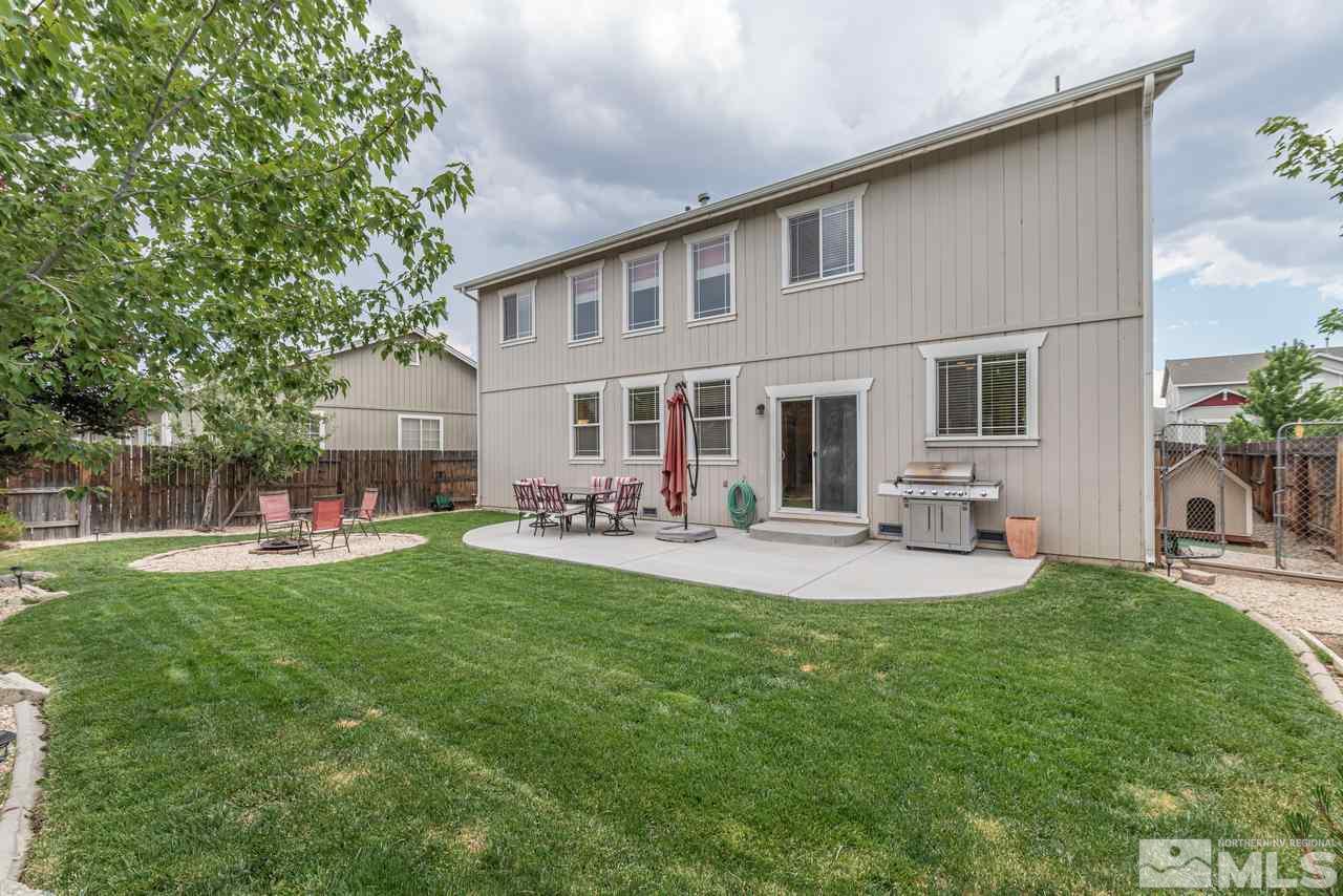 8921 Sorcha Street Reno, NV 89506 - Photo 32 of 35 a front view of a house with patio and garden