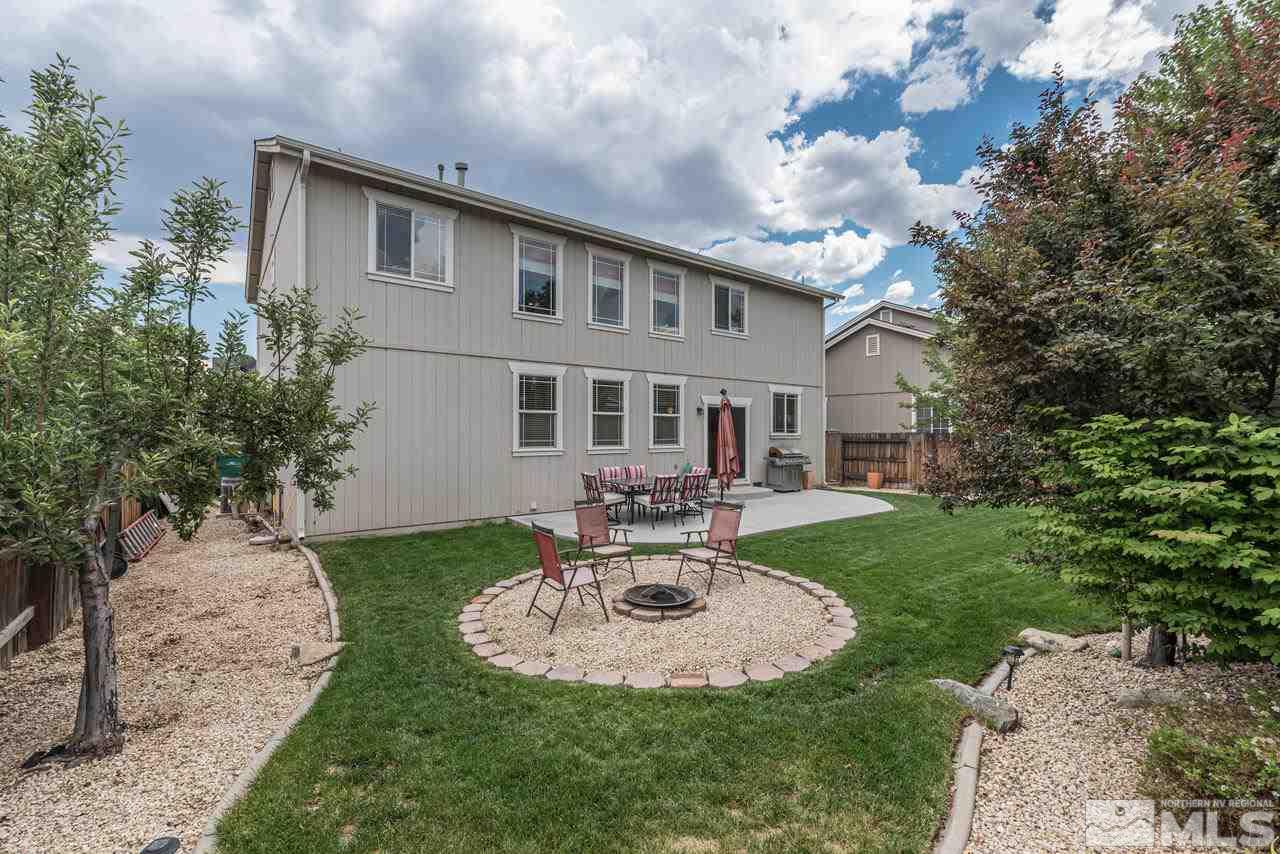 8921 Sorcha Street Reno, NV 89506 - Photo 33 of 35 a view of a house with backyard sitting area and garden