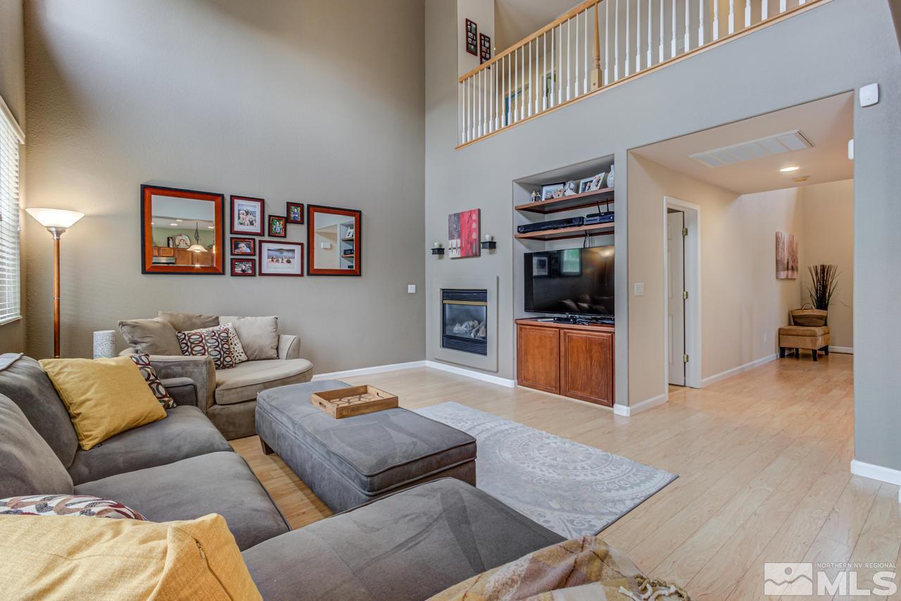 8921 Sorcha Street Reno, NV 89506 - Photo 6 of 35 a living room with furniture and a flat screen tv