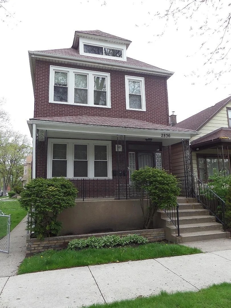 2836 East 84th Street Chicago, IL 60617 - Photo 1 of 7 a front view of a house with garden