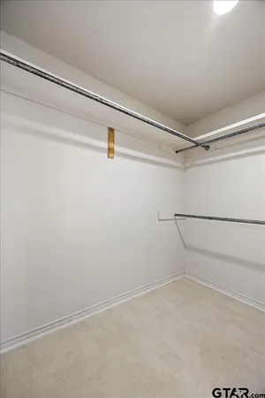 a view of room with wooden floor and windows