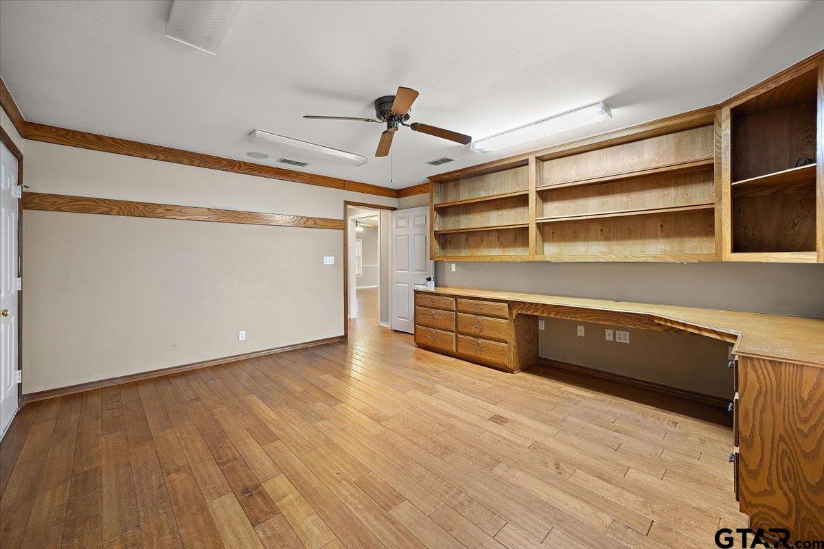 142 Parrish Rusk, TX 75785 - Photo 19 of 43 a view of room with wooden floor and windows
