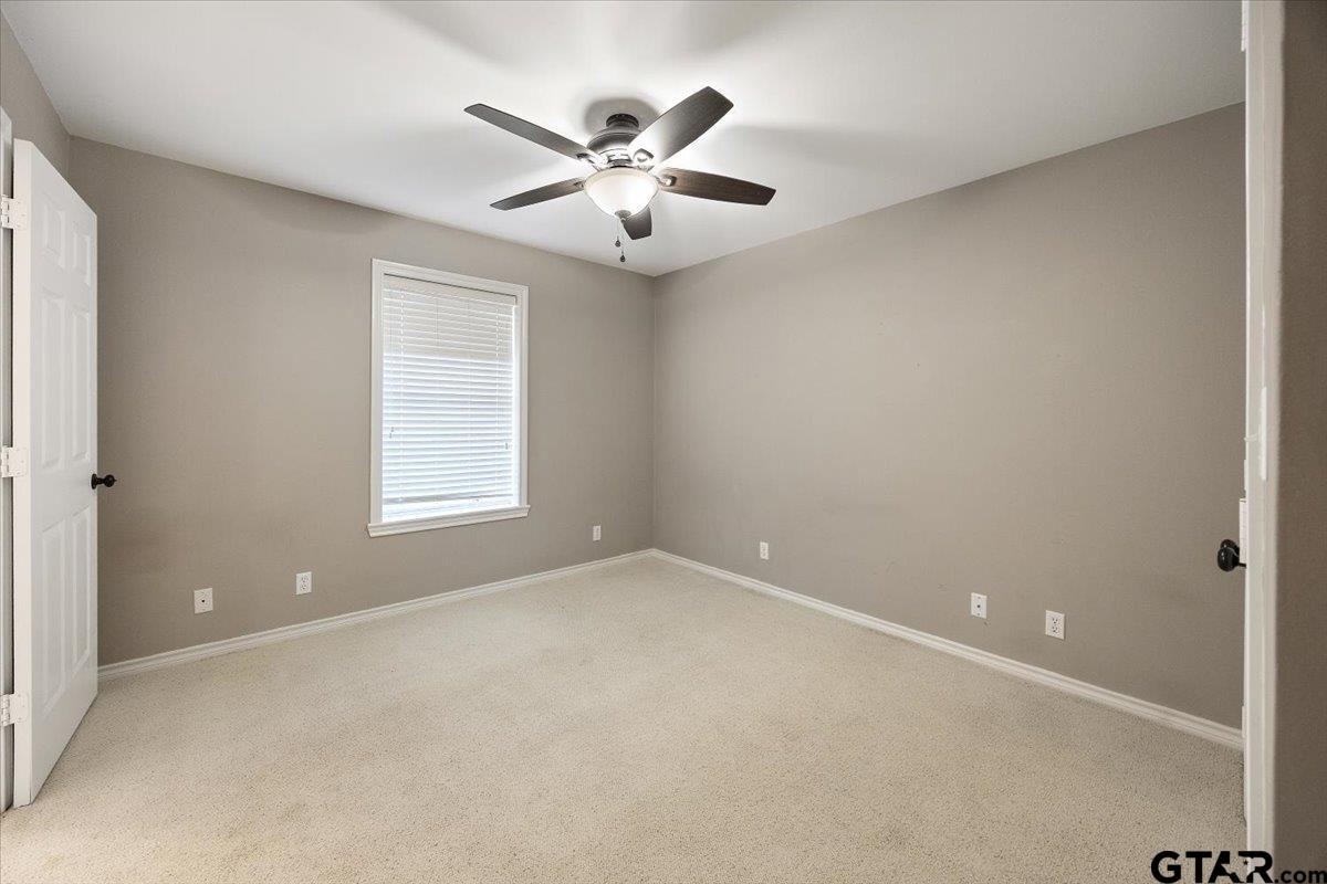 142 Parrish Rusk, TX 75785 - Photo 23 of 43 an empty room with windows and fan