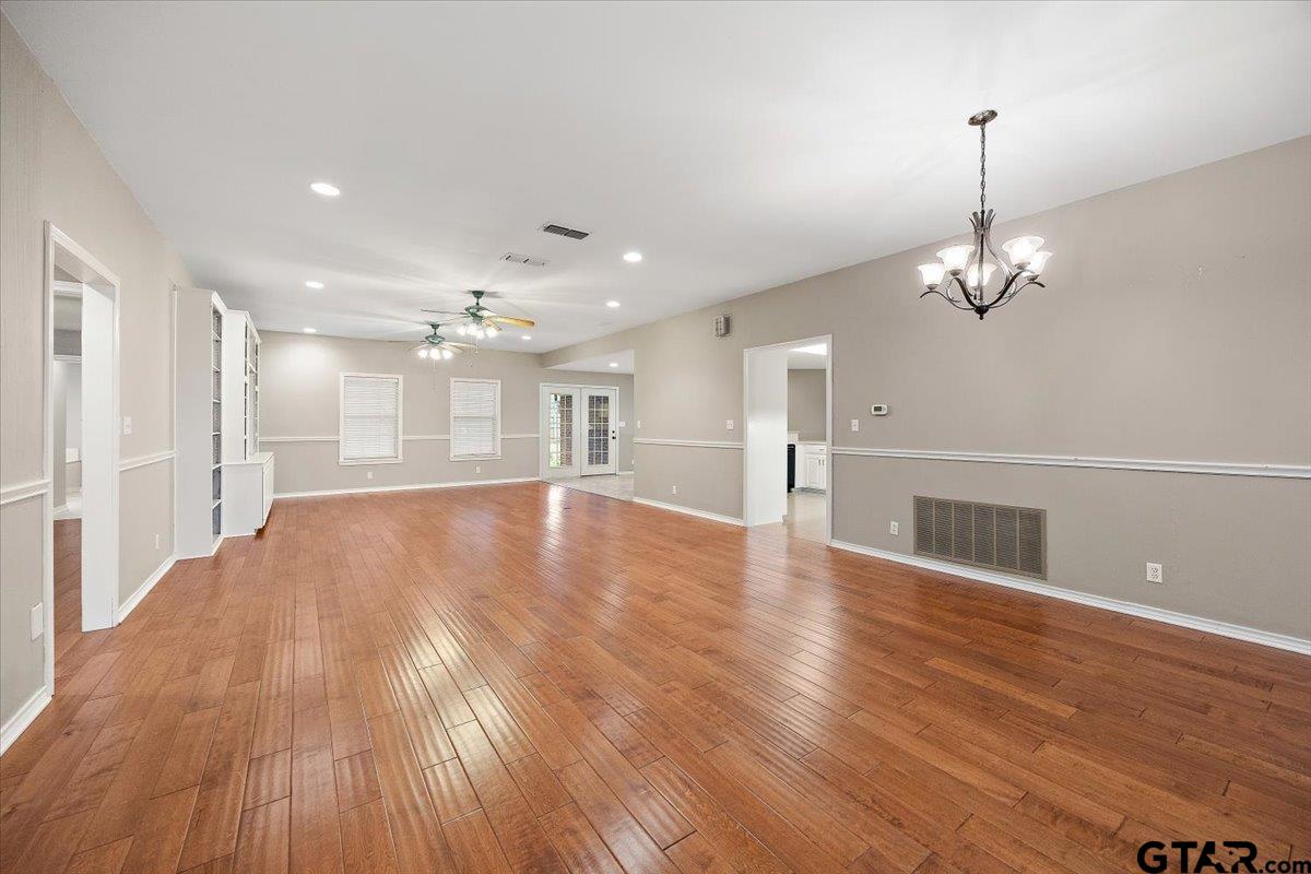 142 Parrish Rusk, TX 75785 - Photo 4 of 43 a view of a room with wooden floor and a kitchen