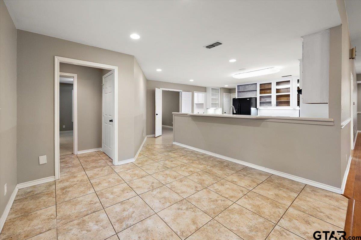 142 Parrish Rusk, TX 75785 - Photo 8 of 43 a view of empty room with kitchen and window
