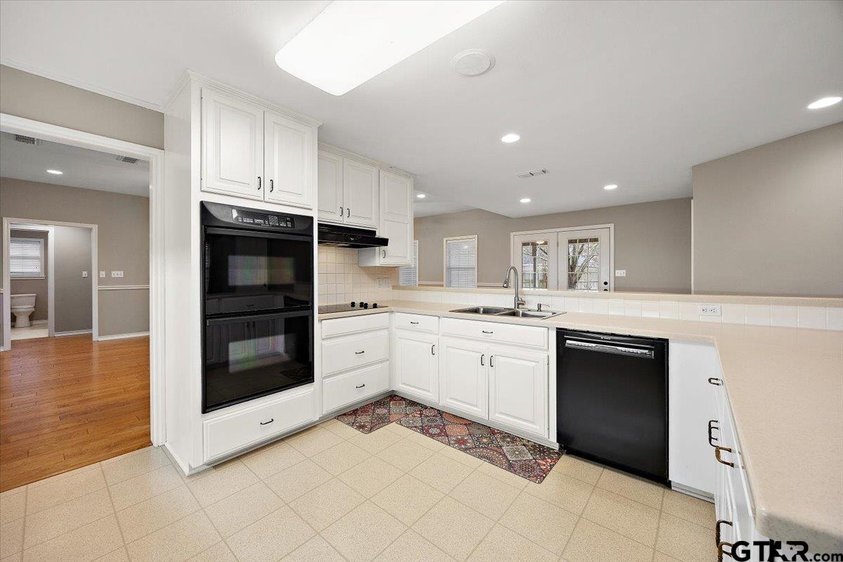 142 Parrish Rusk, TX 75785 - Photo 10 of 43 a kitchen with stainless steel appliances kitchen island granite countertop a sink and cabinets