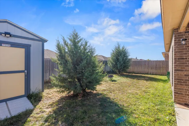 a backyard of a house with lots of green space