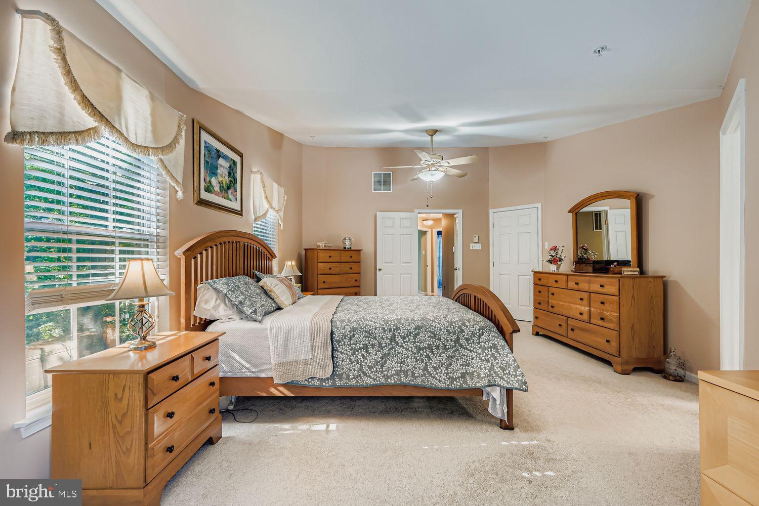 9809 Redwing Drive, Unit 9809 Perry Hall, MD 21128 - Photo 15 of 42 a bedroom with a bed and a dresser