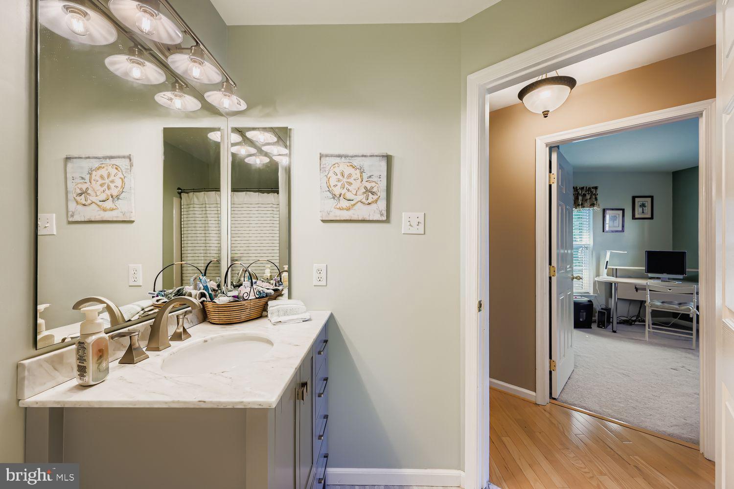 9809 Redwing Drive, Unit 9809 Perry Hall, MD 21128 - Photo 23 of 42 a bathroom with a sink and a mirror