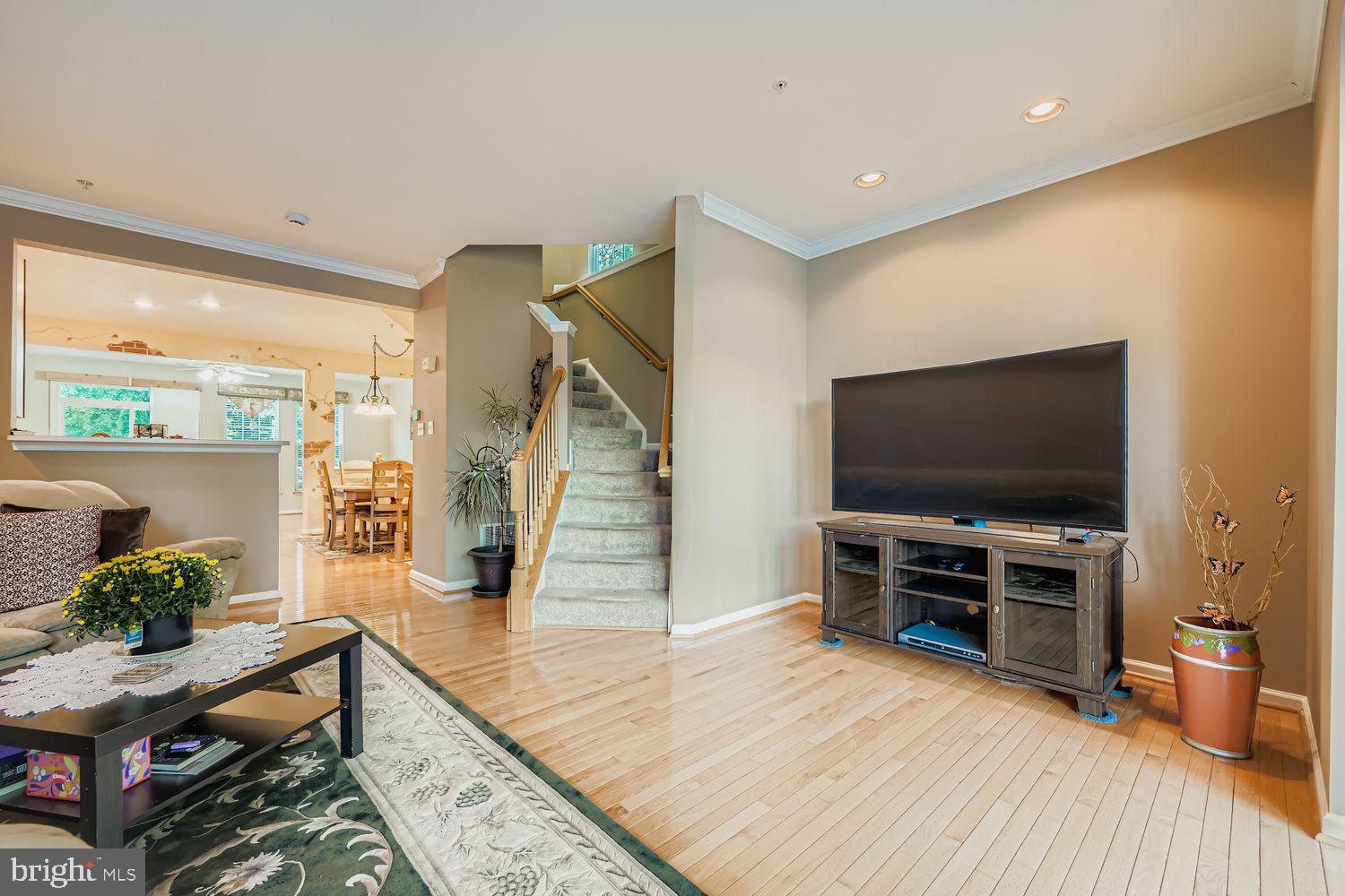 9809 Redwing Drive, Unit 9809 Perry Hall, MD 21128 - Photo 3 of 42 a living room with furniture and a flat screen tv