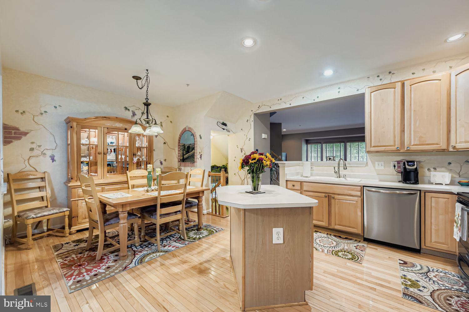 9809 Redwing Drive, Unit 9809 Perry Hall, MD 21128 - Photo 8 of 42 a kitchen with stainless steel appliances granite countertop a sink and cabinets