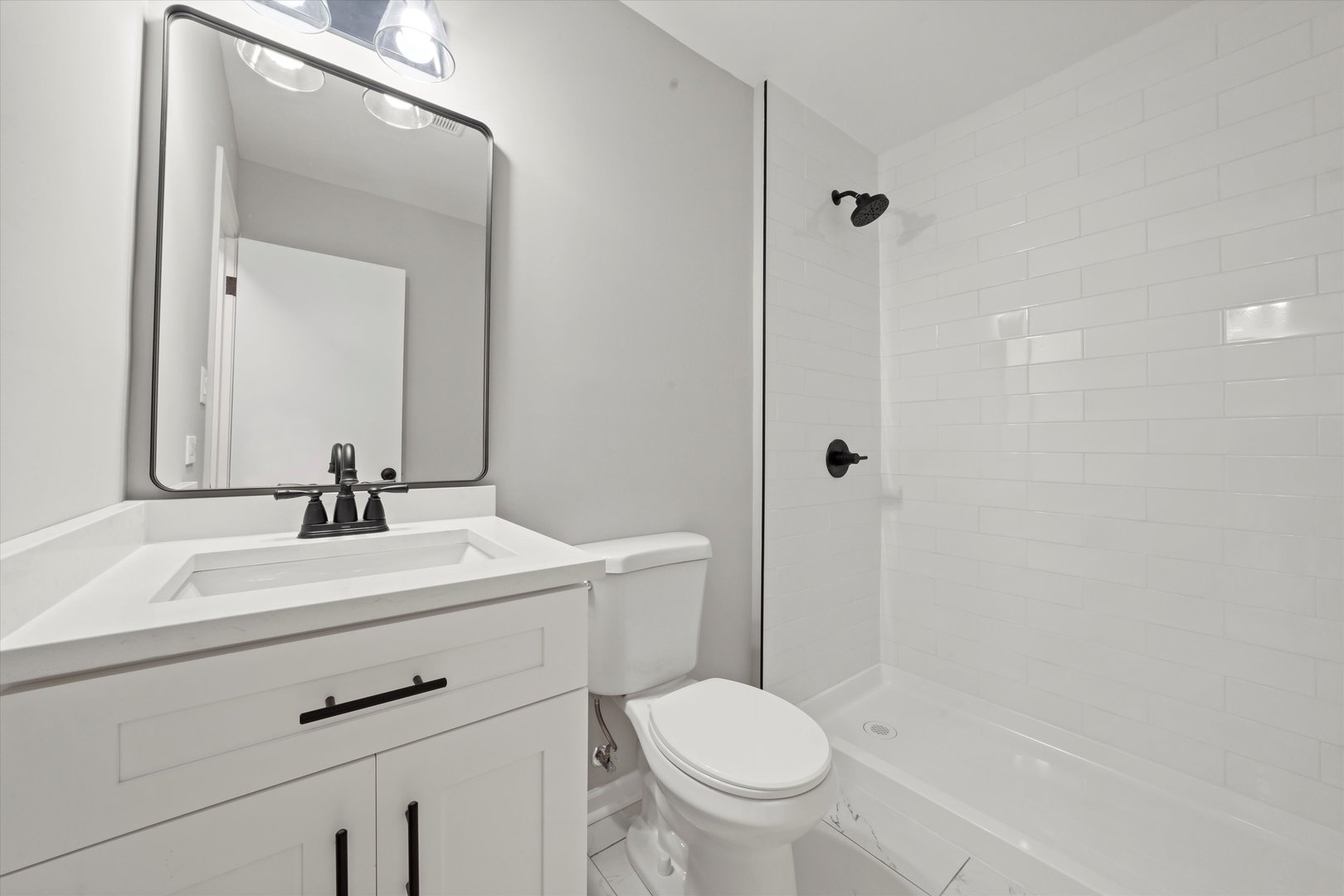 5426 Wolf Road Western Springs, IL 60558 - Photo 11 of 19 a bathroom with a sink toilet and shower