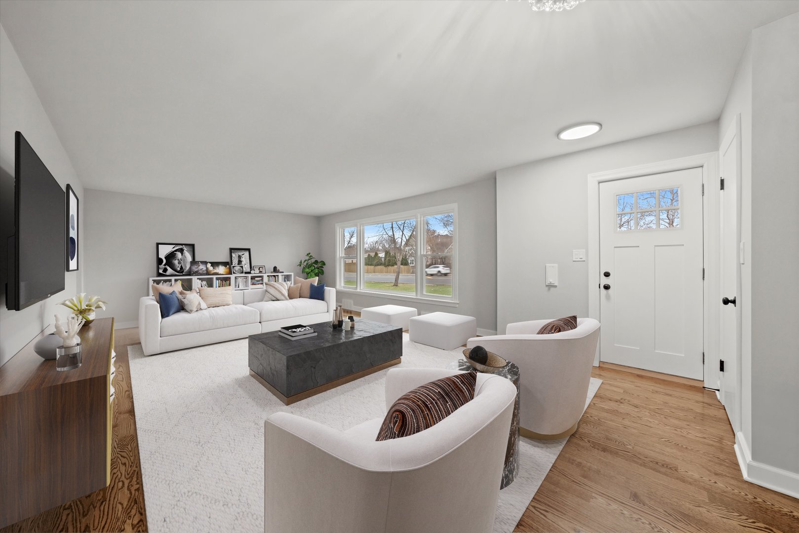 5426 Wolf Road Western Springs, IL 60558 - Photo 3 of 19 a living room with furniture and a flat screen tv