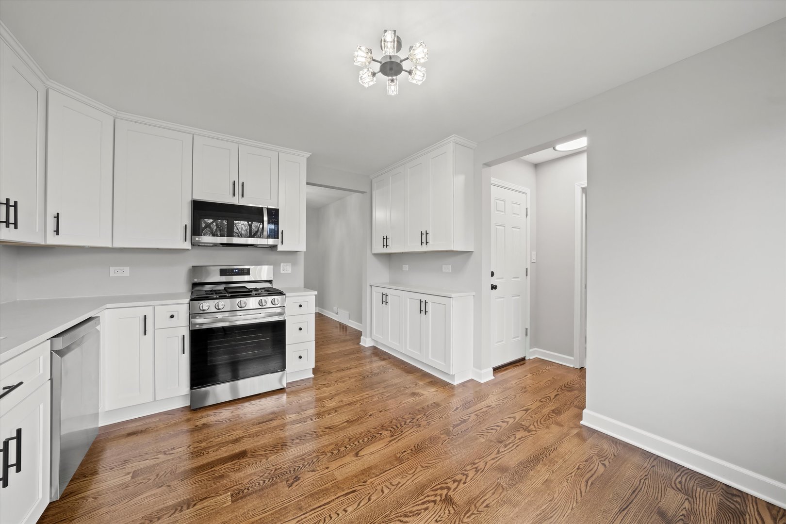 5426 Wolf Road Western Springs, IL 60558 - Photo 5 of 19 a kitchen with stainless steel appliances a stove a sink and a refrigerator