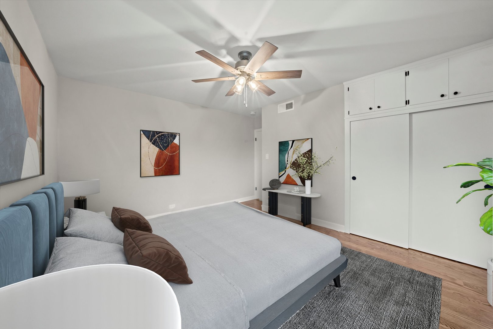 5426 Wolf Road Western Springs, IL 60558 - Photo 9 of 19 a bedroom with a bed and ceiling fan