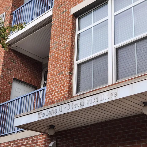 a view of a balcony with wooden floor