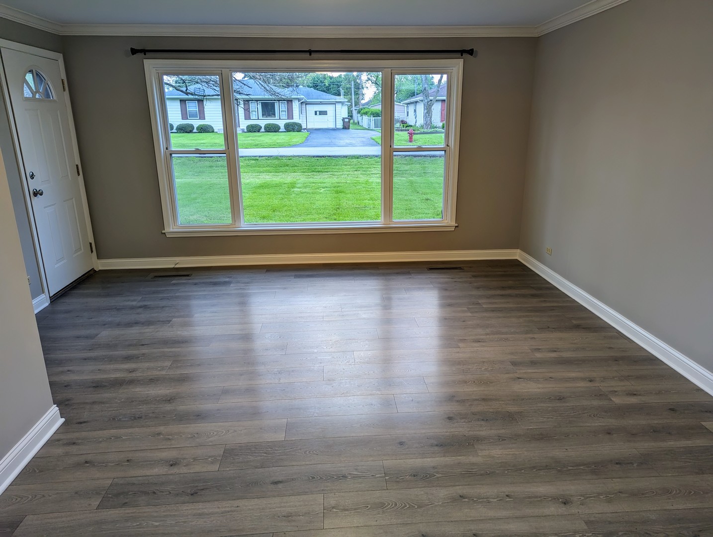 137 Inner Court New Lenox, IL 60451 - Photo 5 of 13 a view of room with window and wooden floor
