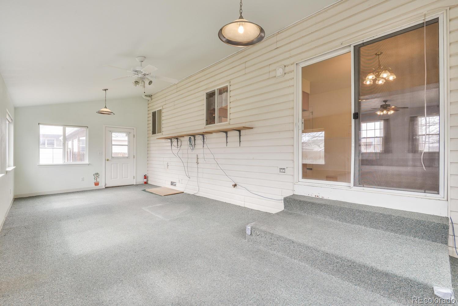 1437 Walnut Street Windsor, CO 80550 - Photo 14 of 35 an empty room with windows and entrance