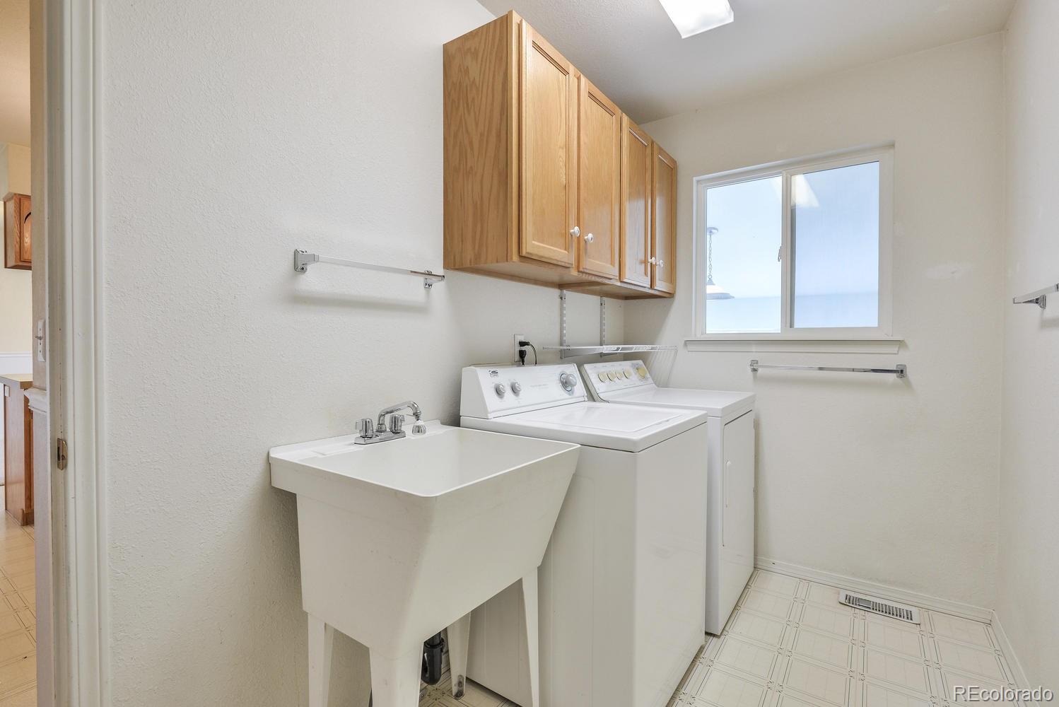 1437 Walnut Street Windsor, CO 80550 - Photo 15 of 35 a bathroom with a sink and a mirror