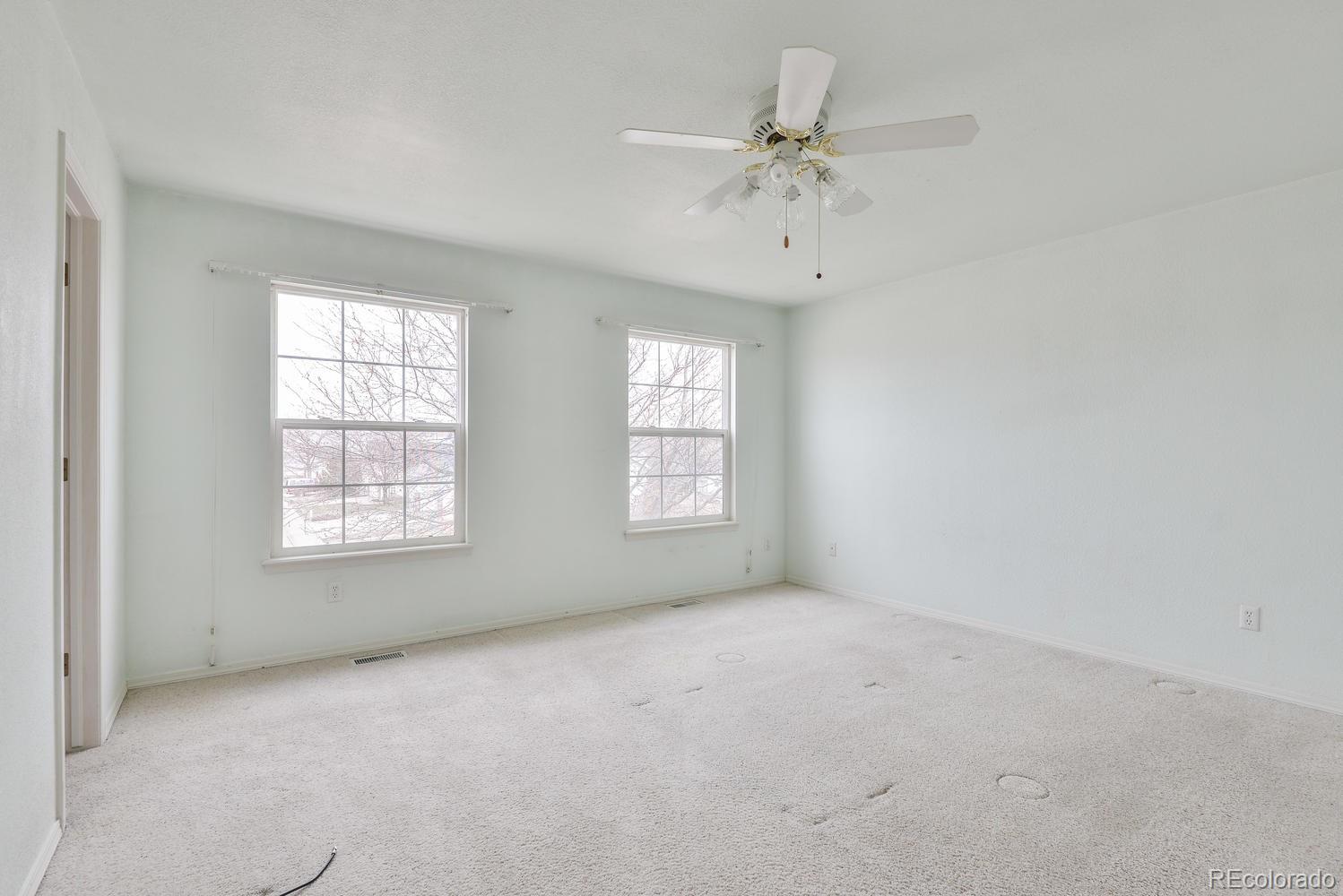 1437 Walnut Street Windsor, CO 80550 - Photo 16 of 35 an empty room with a window
