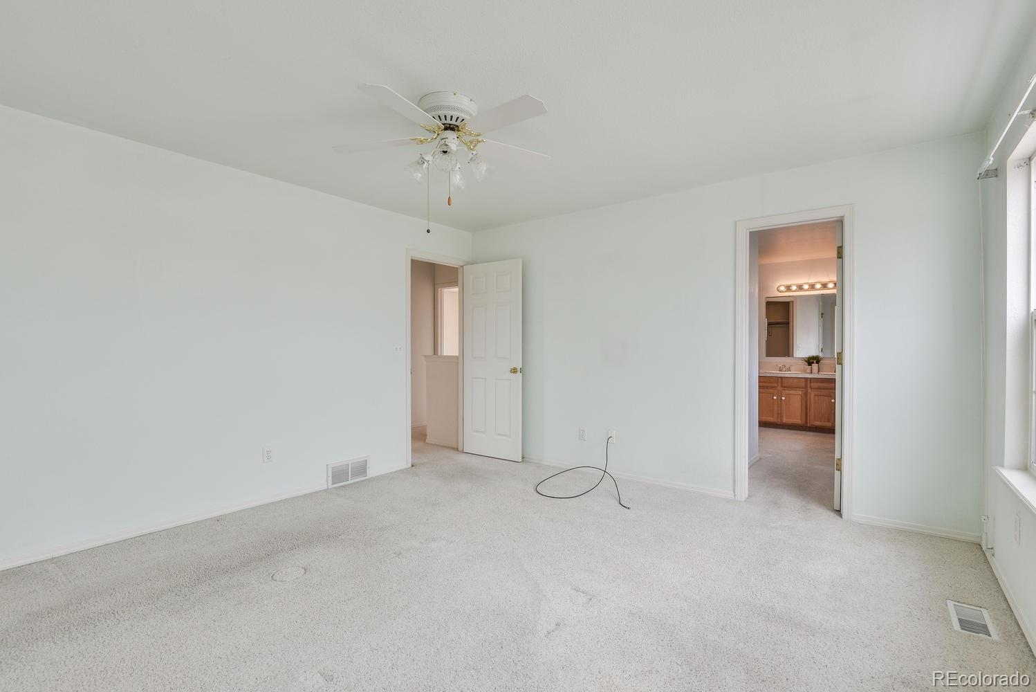 1437 Walnut Street Windsor, CO 80550 - Photo 17 of 35 an empty room with fan