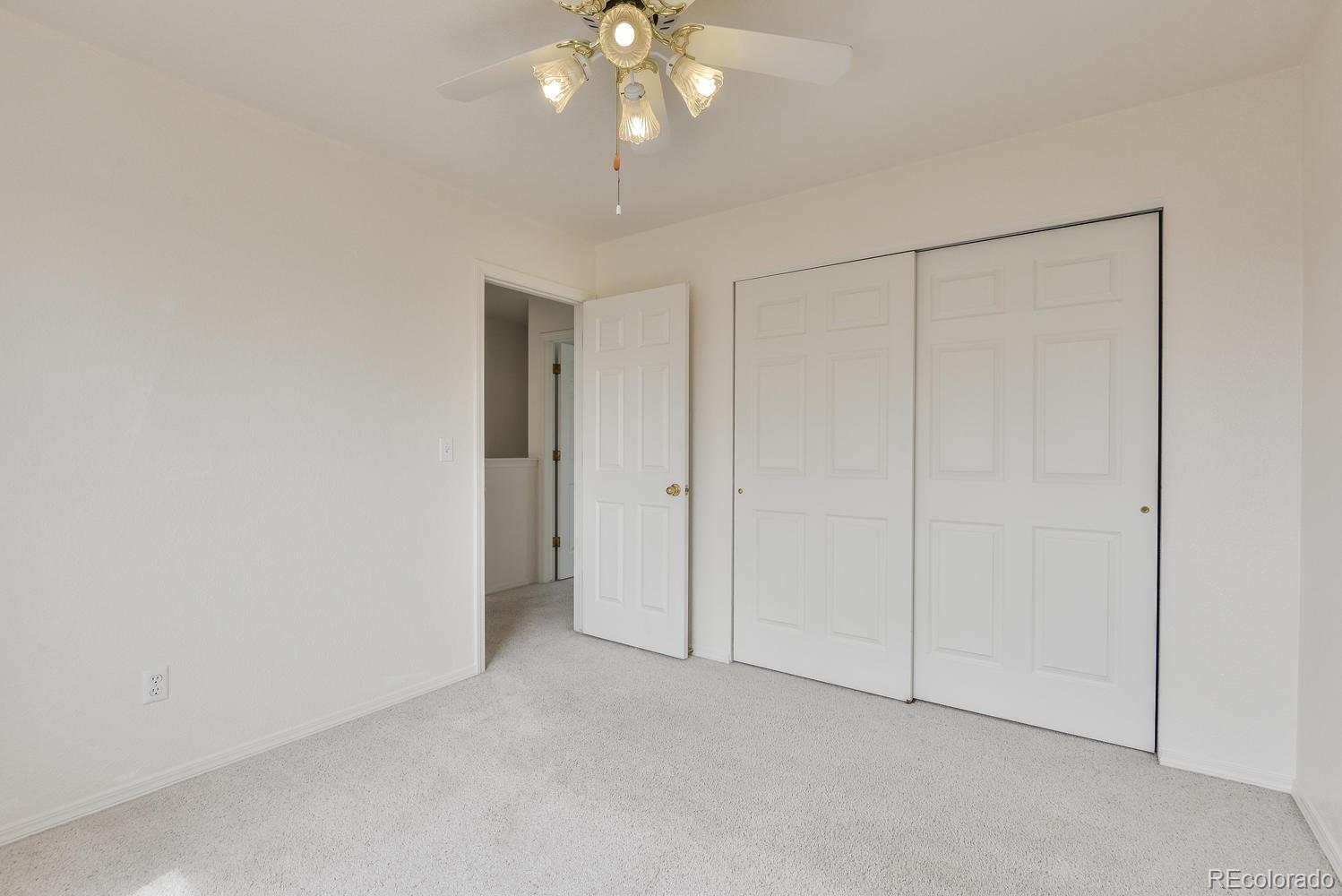 1437 Walnut Street Windsor, CO 80550 - Photo 22 of 35 an empty room with fan
