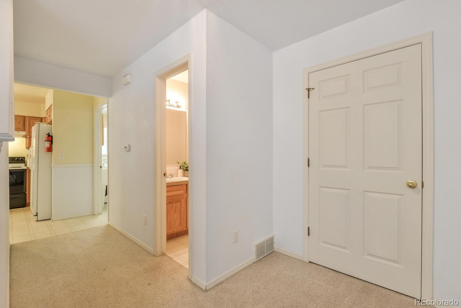 1437 Walnut Street Windsor, CO 80550 - Photo 3 of 35 an empty room with windows
