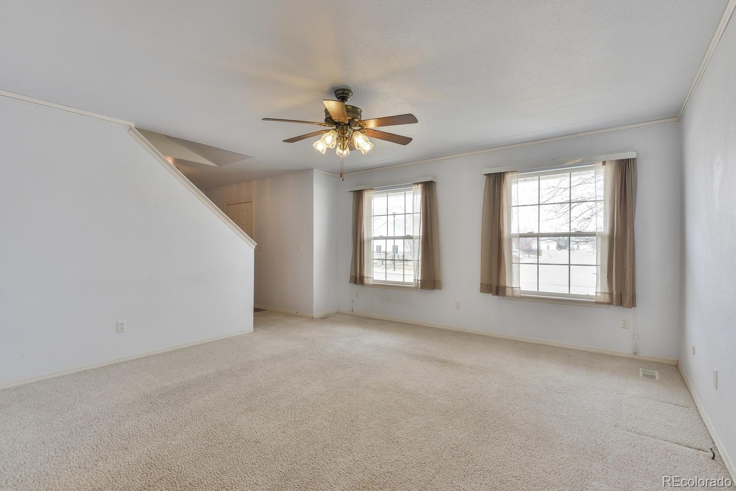 1437 Walnut Street Windsor, CO 80550 - Photo 5 of 35 a view of an empty room with a window