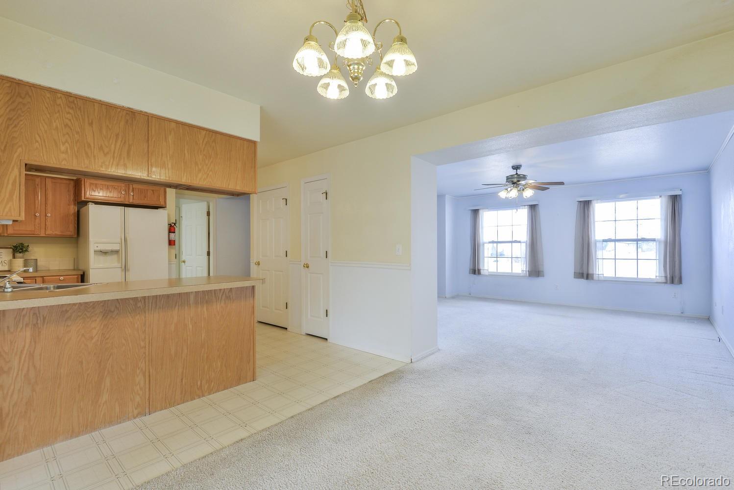1437 Walnut Street Windsor, CO 80550 - Photo 8 of 35 a view of an empty room with a window