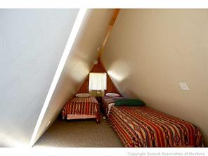 171 Z (aka Barking Dog Rd) Road Silverthorne, CO 80498 - Photo 19 of 25 a view of a bedroom with wooden floor and windows