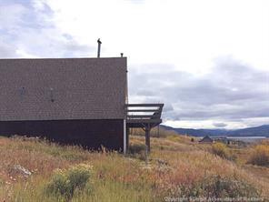 171 Z (aka Barking Dog Rd) Road Silverthorne, CO 80498 - Photo 3 of 25 a backyard of a house with table and chairs