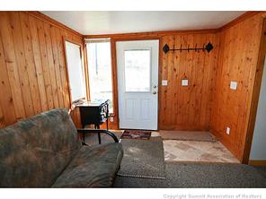171 Z (aka Barking Dog Rd) Road Silverthorne, CO 80498 - Photo 7 of 25 a living room with furniture and a window