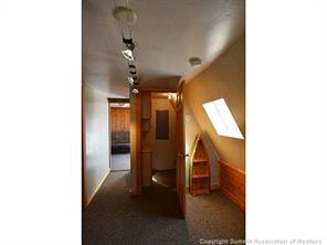 171 Z (aka Barking Dog Rd) Road Silverthorne, CO 80498 - Photo 10 of 25 a view of a hallway with furniture and entryway